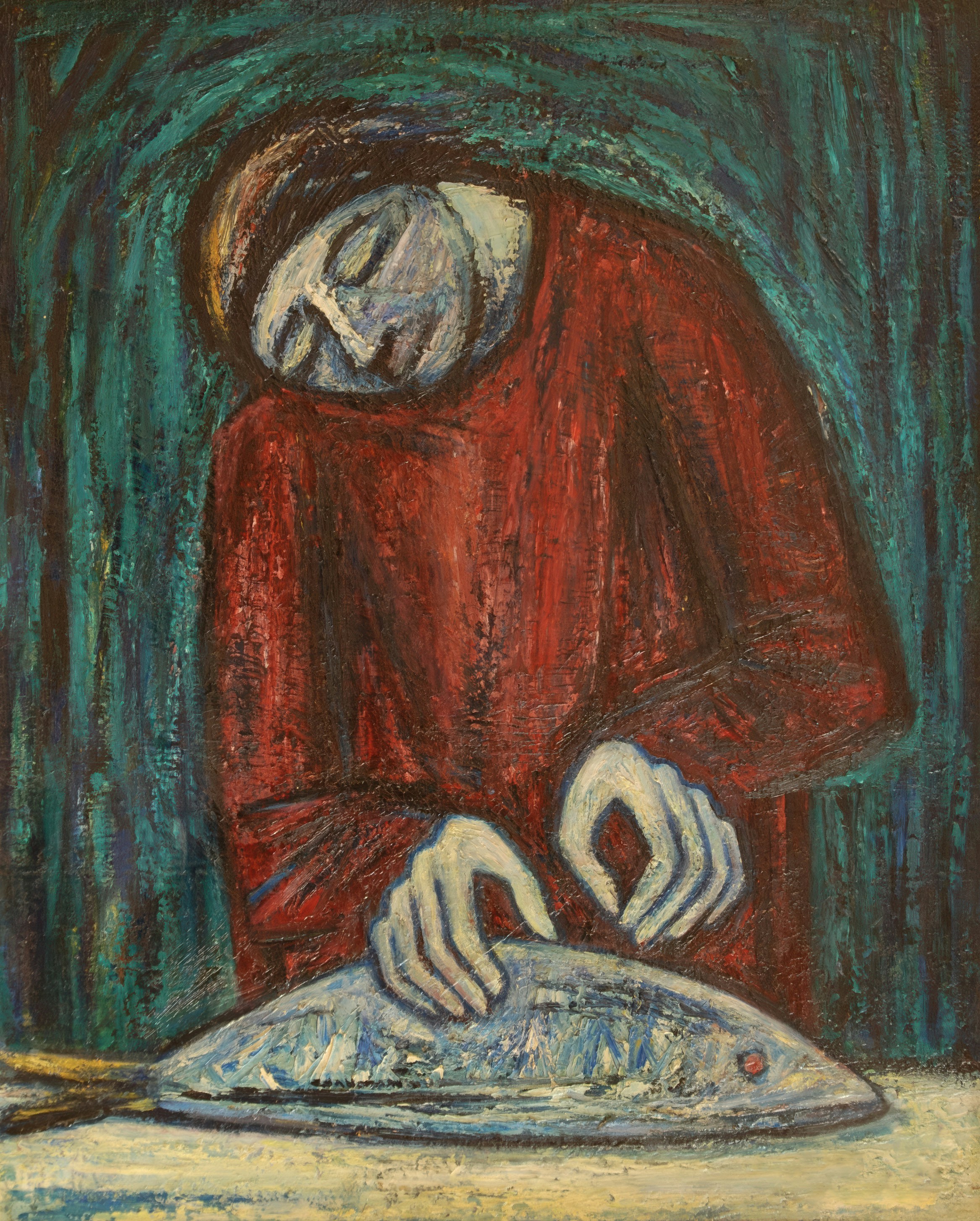 붉은 옷을 입은 사람이 생선을 준비하고 있다