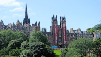 A grand, old building stands tall in edinburgh.
