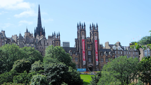 A grand, old building stands tall in edinburgh.