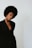 Woman poses confidently in a black blazer.