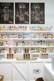 Spray paint cans are neatly organized on shelves.