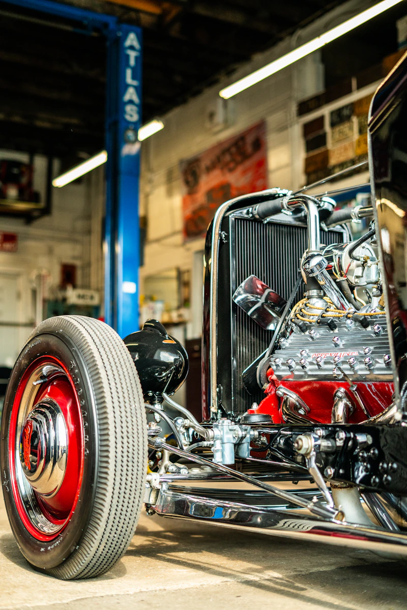 A vintage hot rod in a garage