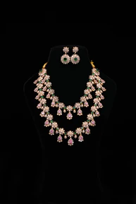 Elegant jewelry set displayed on a black mannequin.