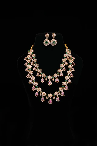 Elegant jewelry set displayed on a black mannequin.