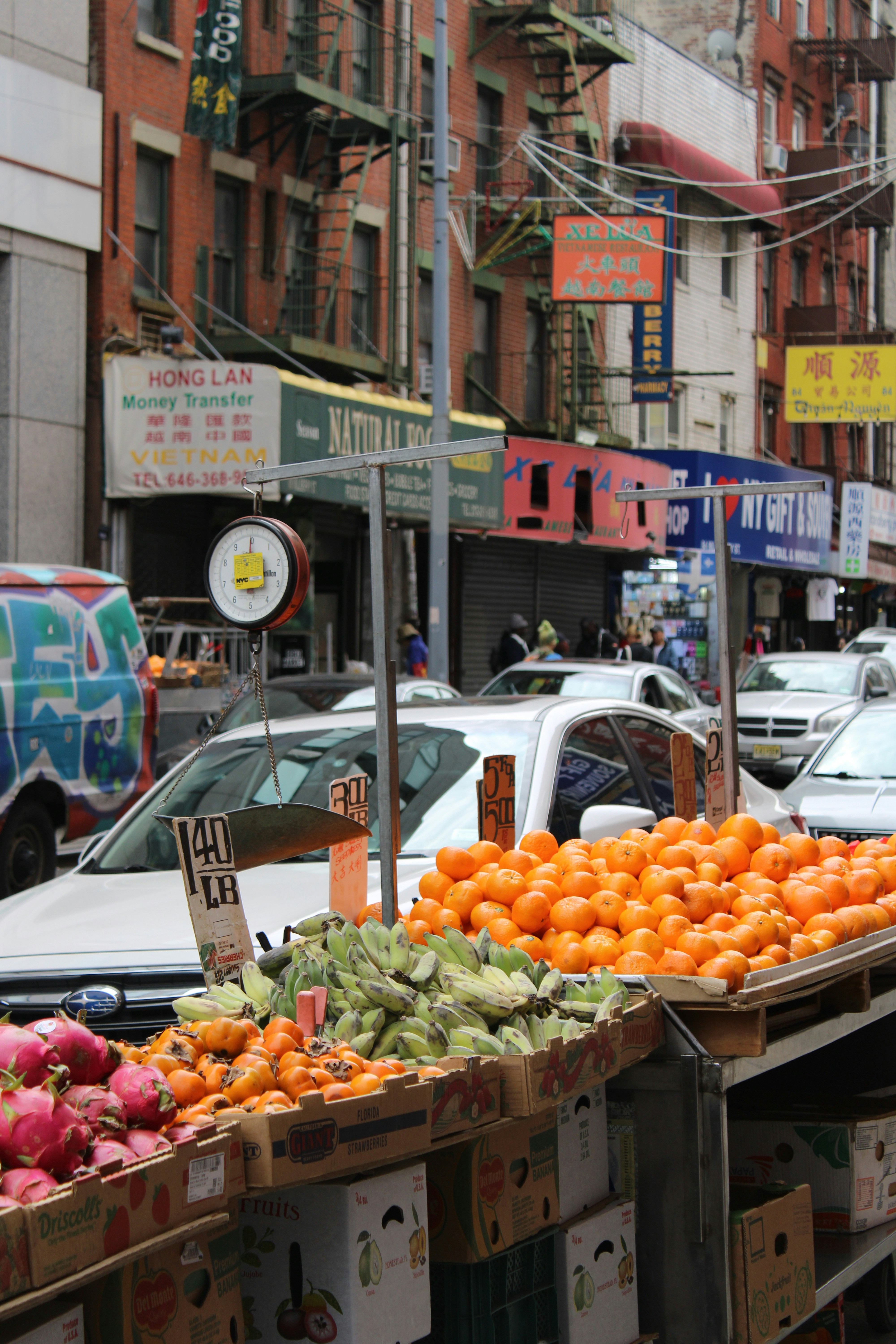 Fresh produce is for sale on a city street.