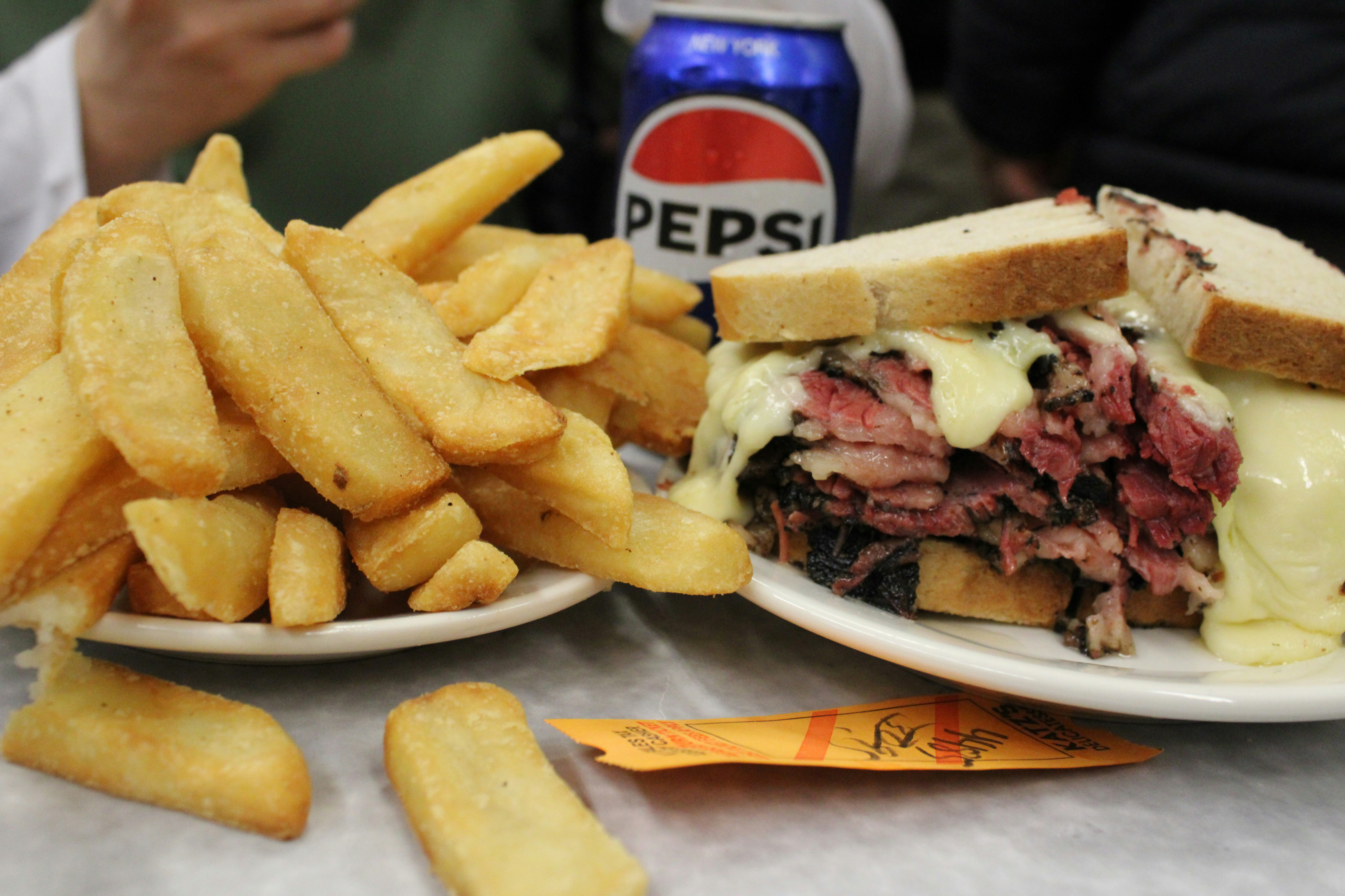 A delicious sandwich, fries, and pepsi!