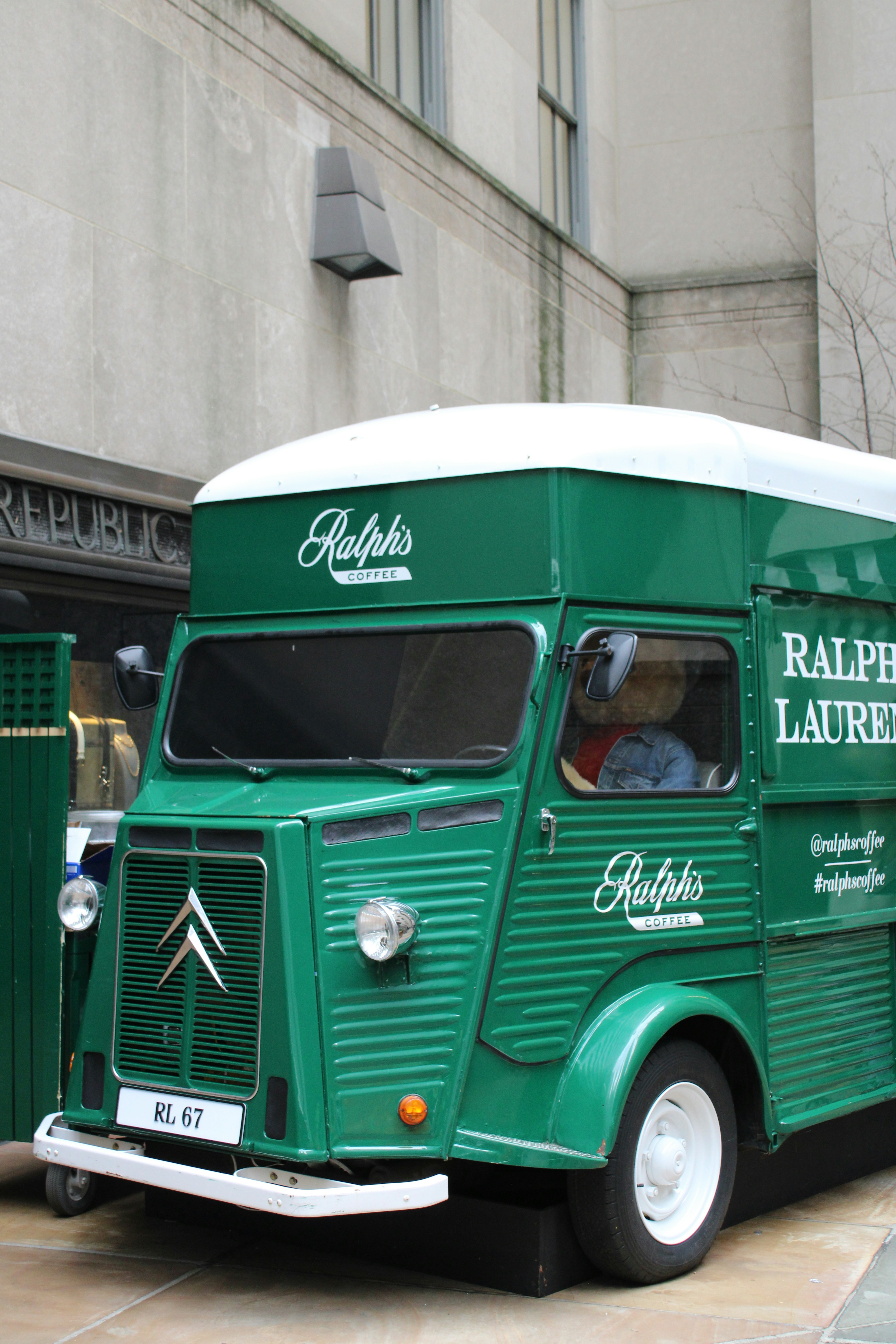 A ralph lauren coffee truck is parked on the street.