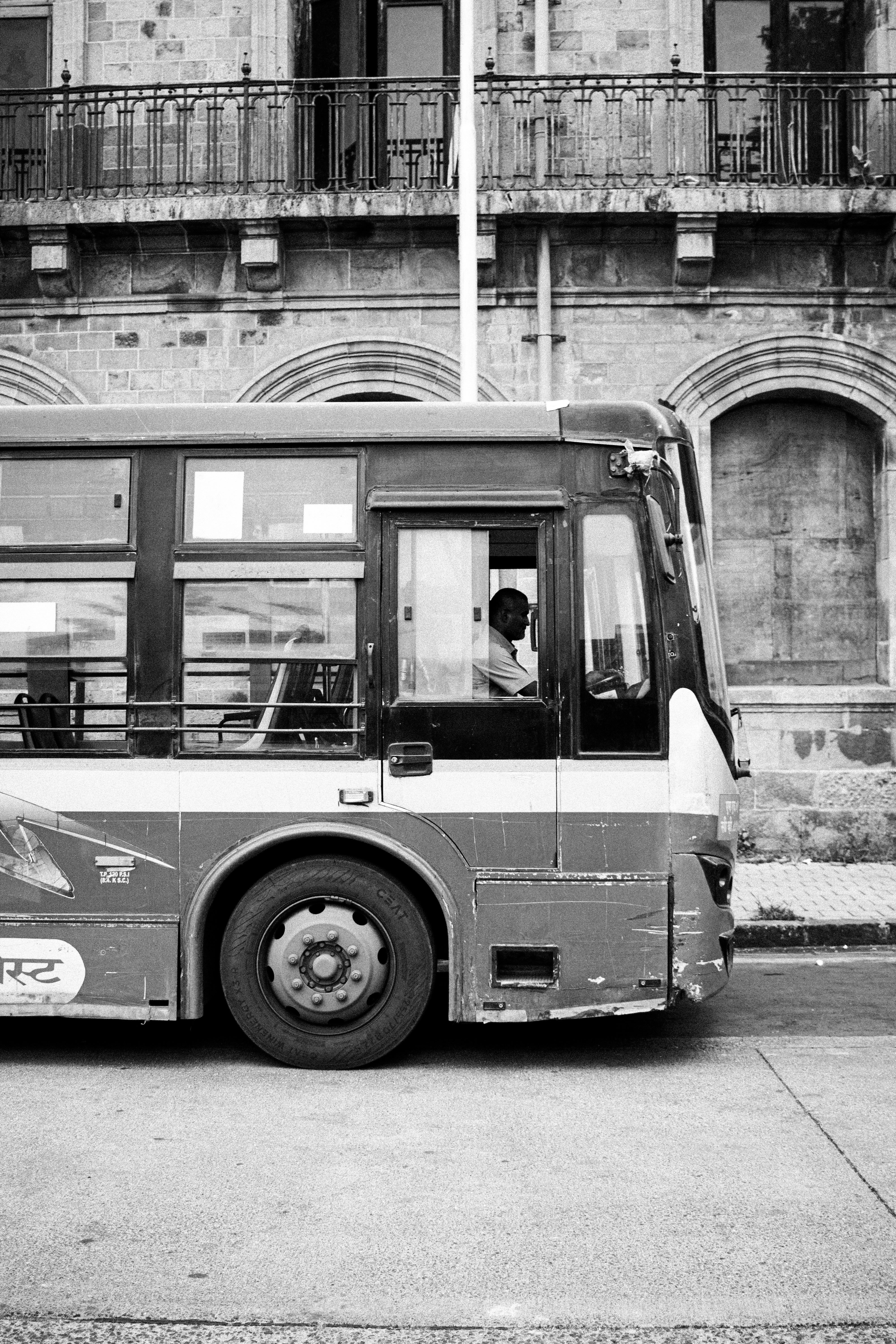 A bus driver is seen in his vehicle.