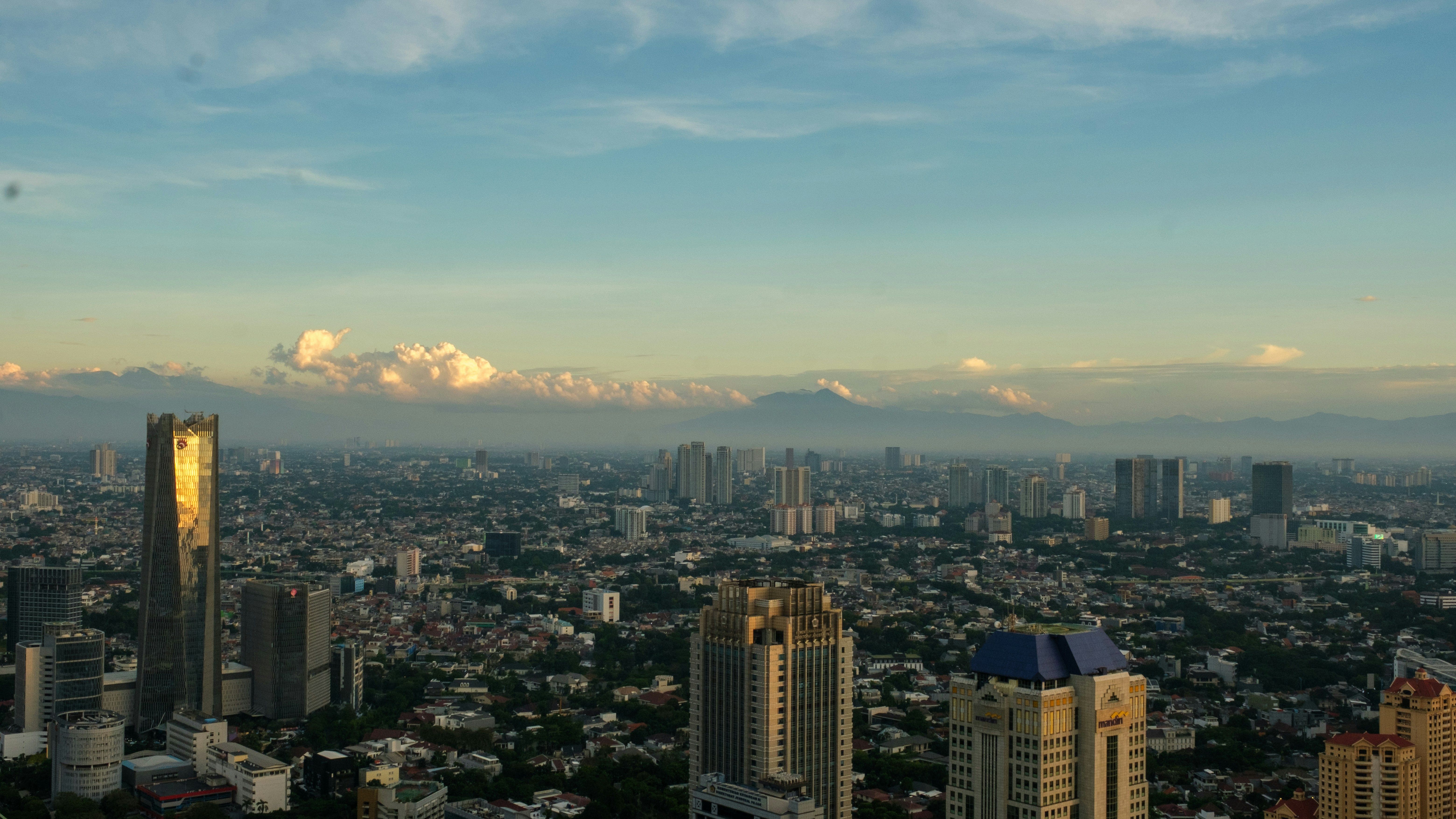 Cityscape bathed in warm morning light.