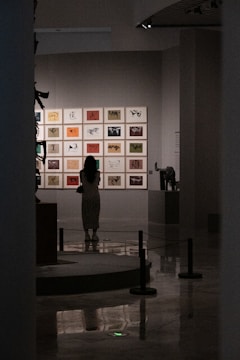 A woman admiring art in a museum.