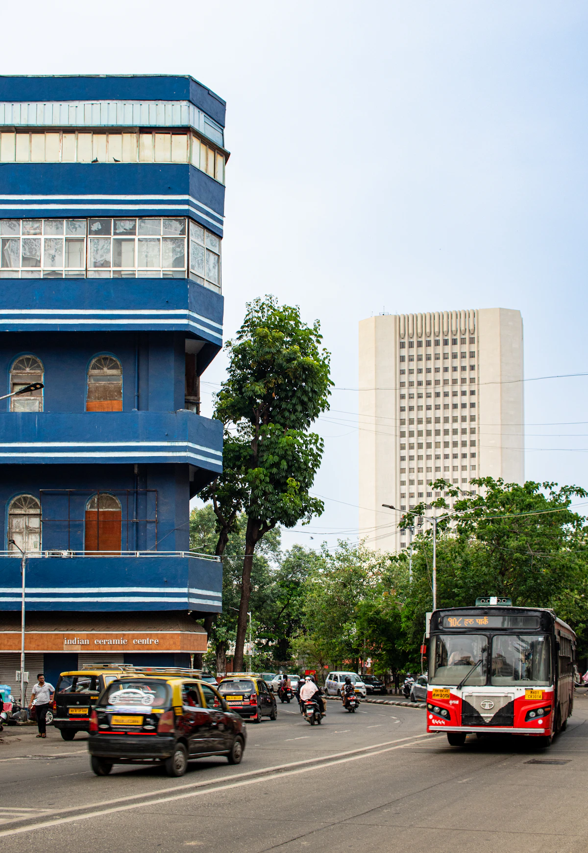 A red city bus on a Mumbai street