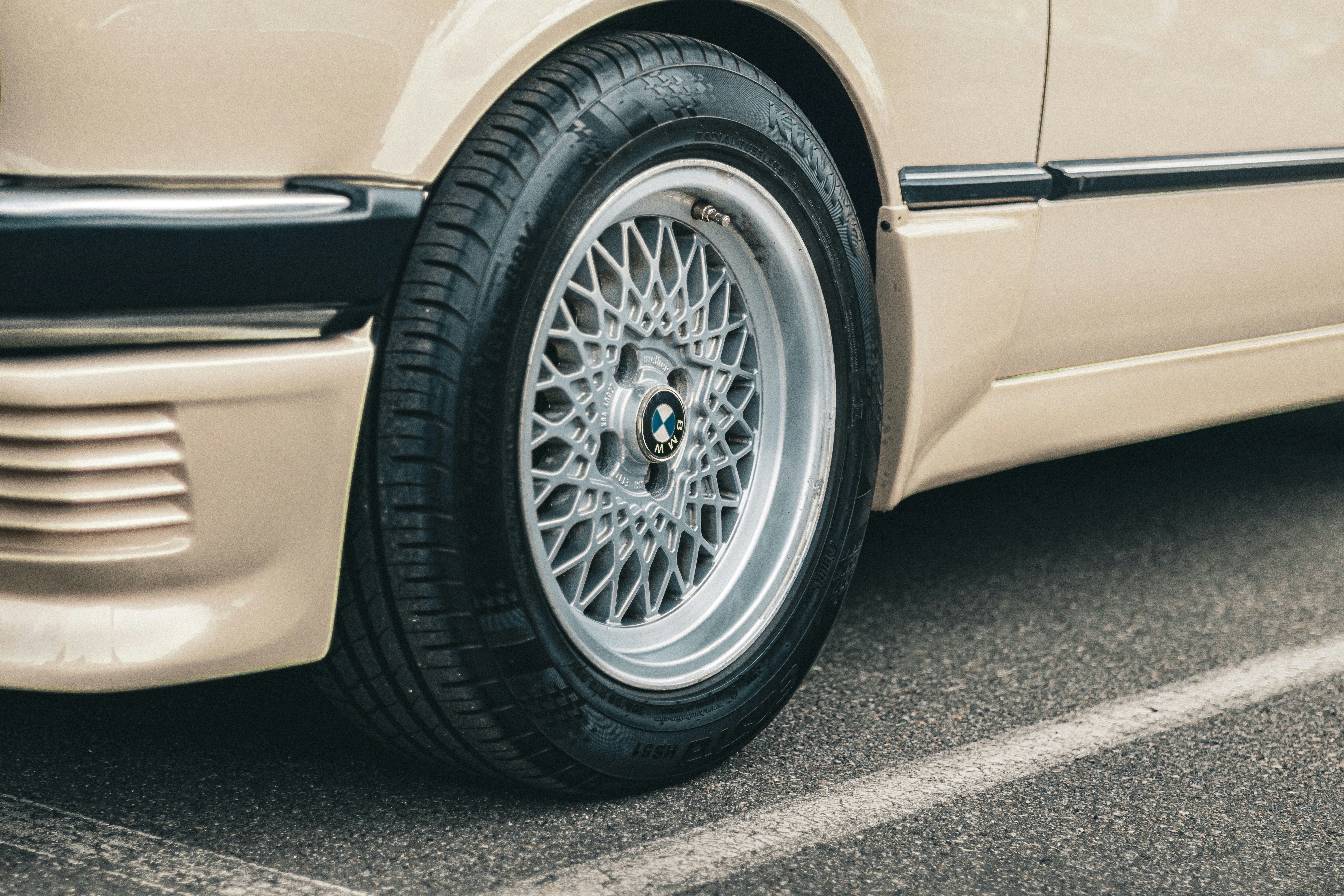 A classic car's wheel and tire.