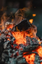 Burning embers and flames ignite brightly.