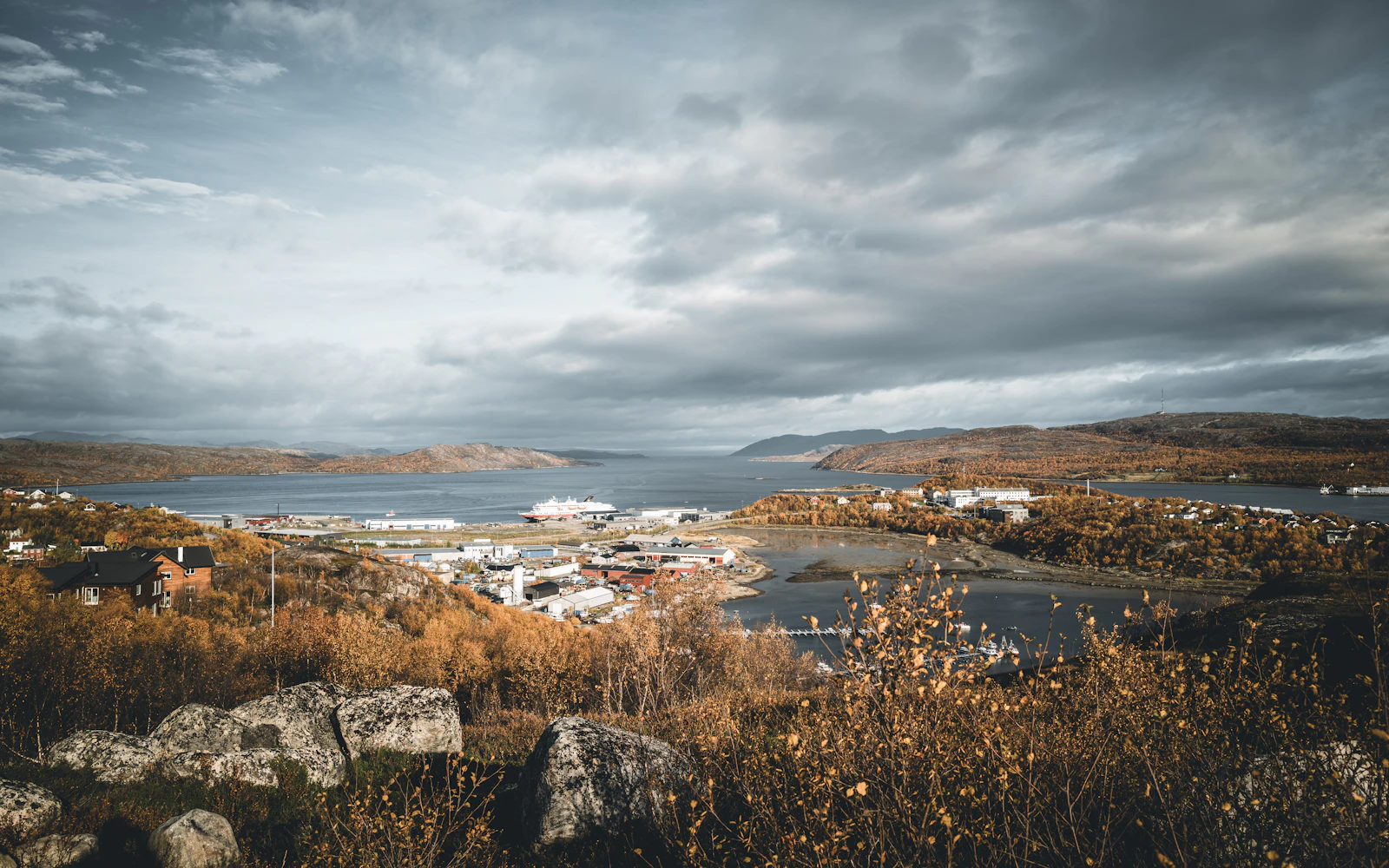 Kirkenes and its harbour under a heavy autumn sky — Finnmark, Norway