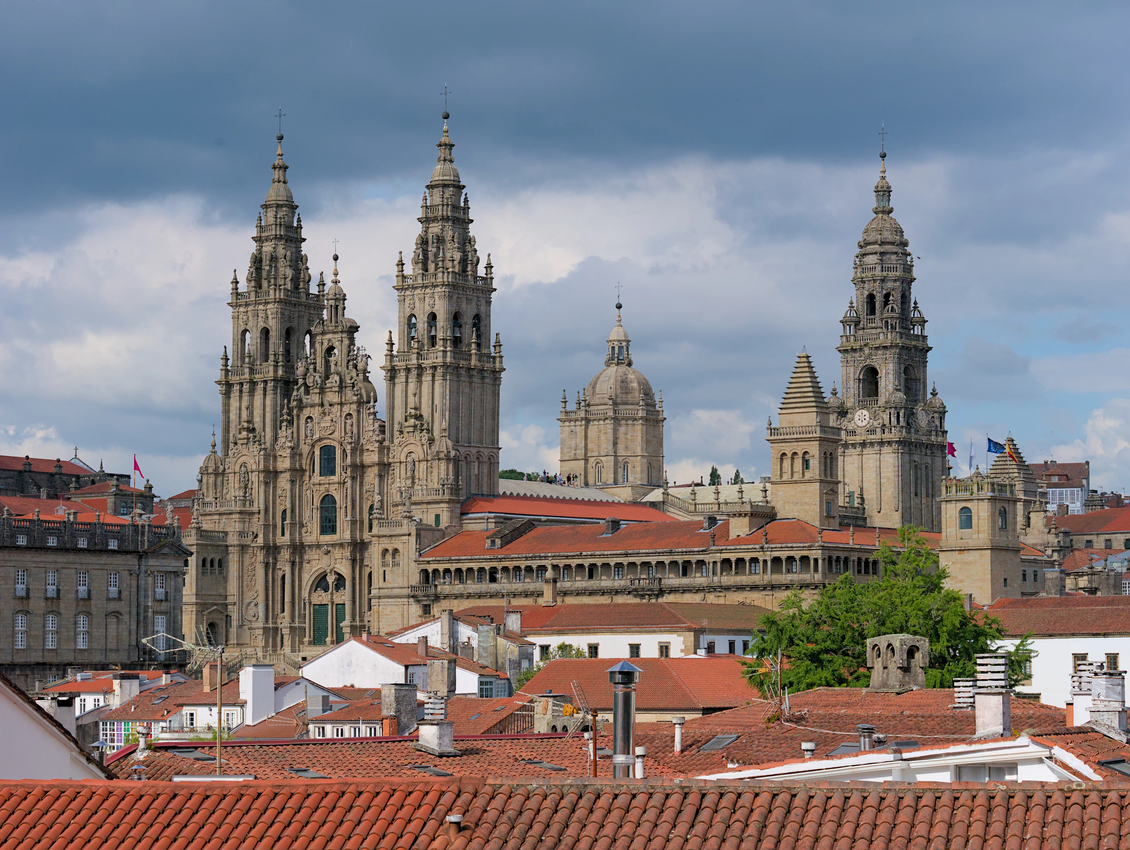 The towers of Santiago de Compostela's cathedral above the red roofs of the old town