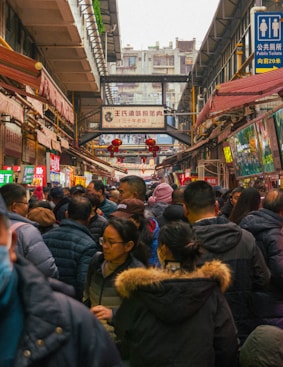 Crowded market filled with many people.