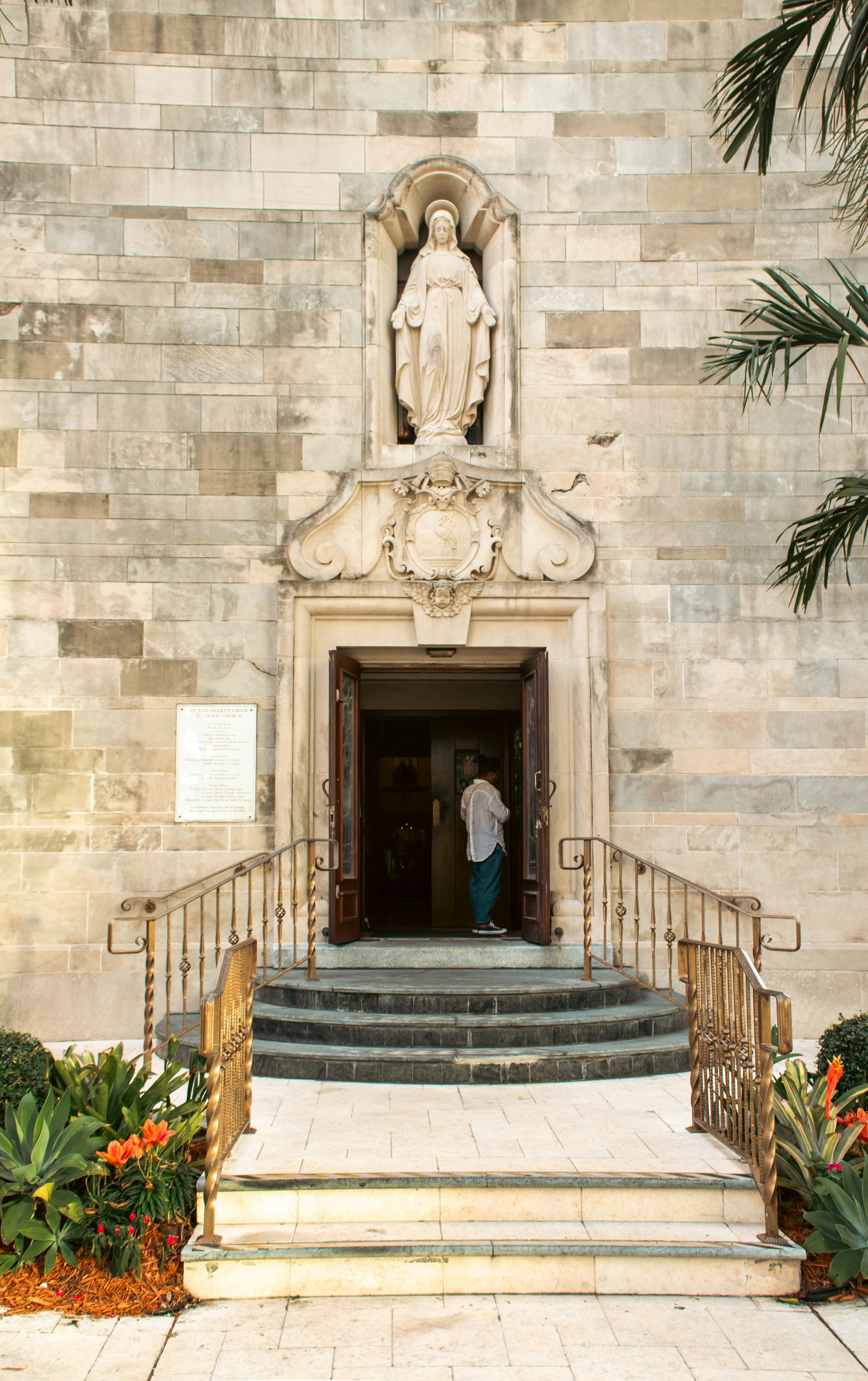 A church entrance with a religious statue. photo – Free Church Image on ...