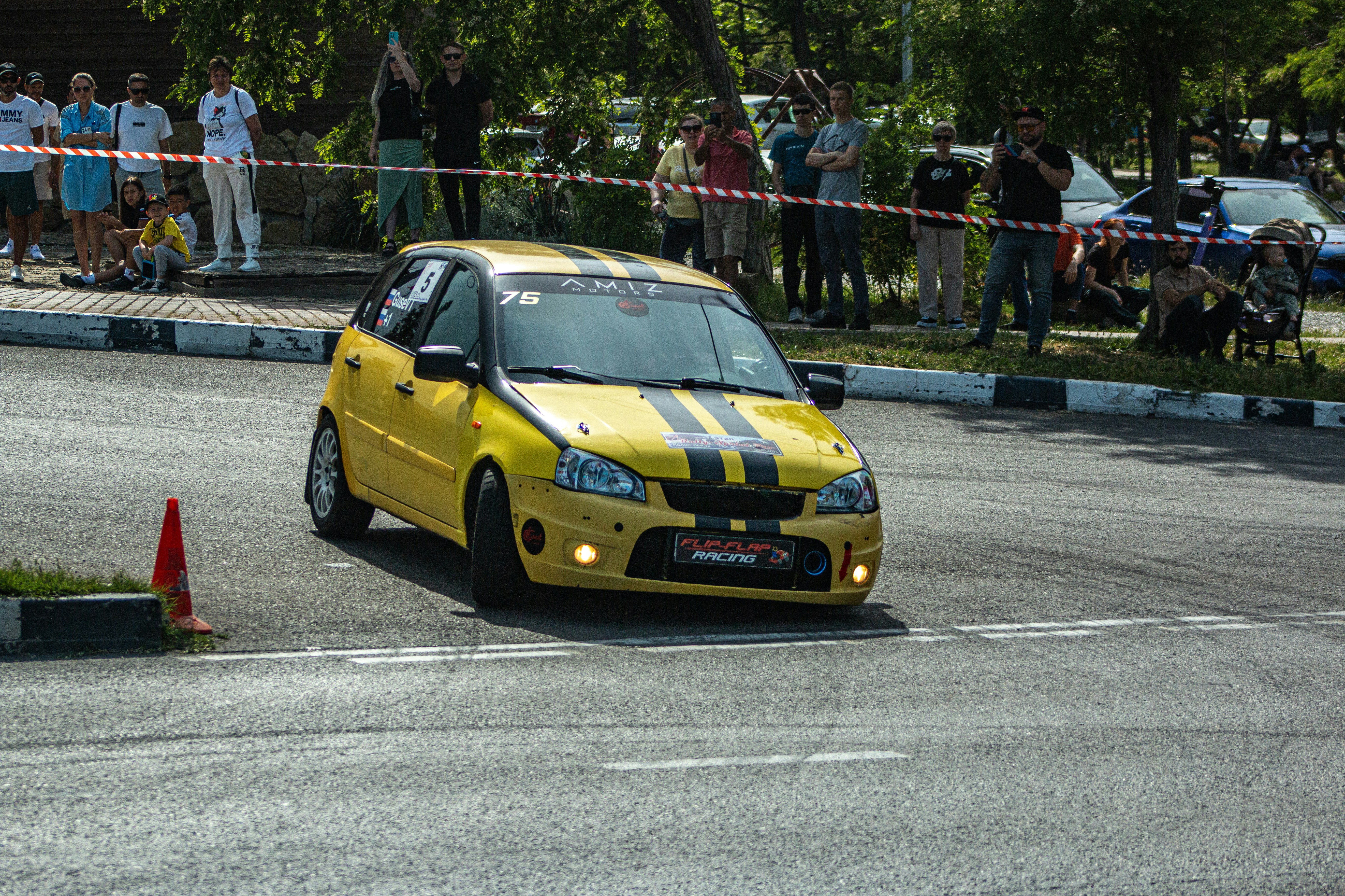 A yellow race car starts its race.