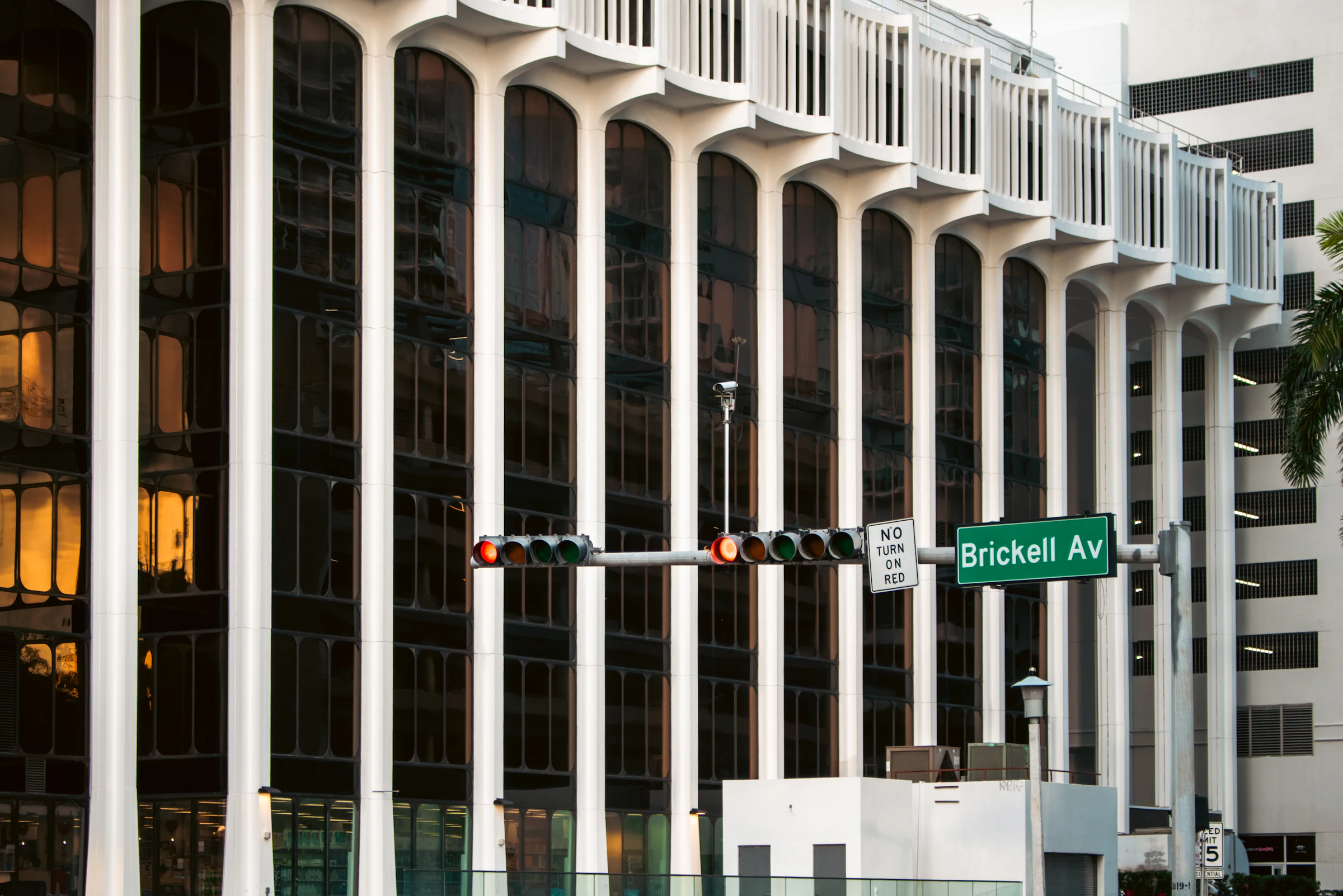 Tall vertical columns of a grand classical building facade rising into the sky.
