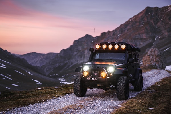 Jeep on a mountain trail at dusk
