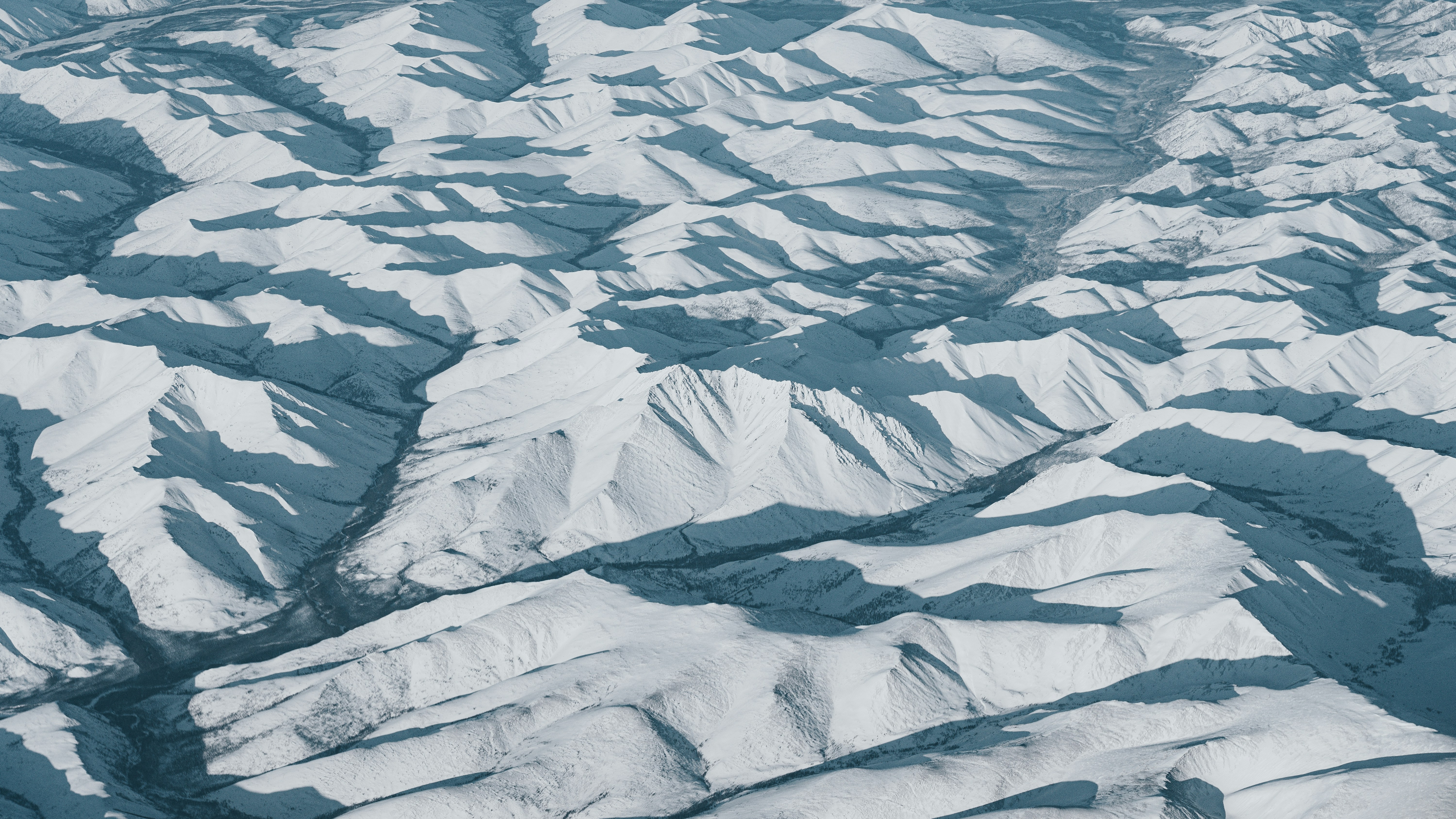 Snow-covered mountains create beautiful and vast landscapes.