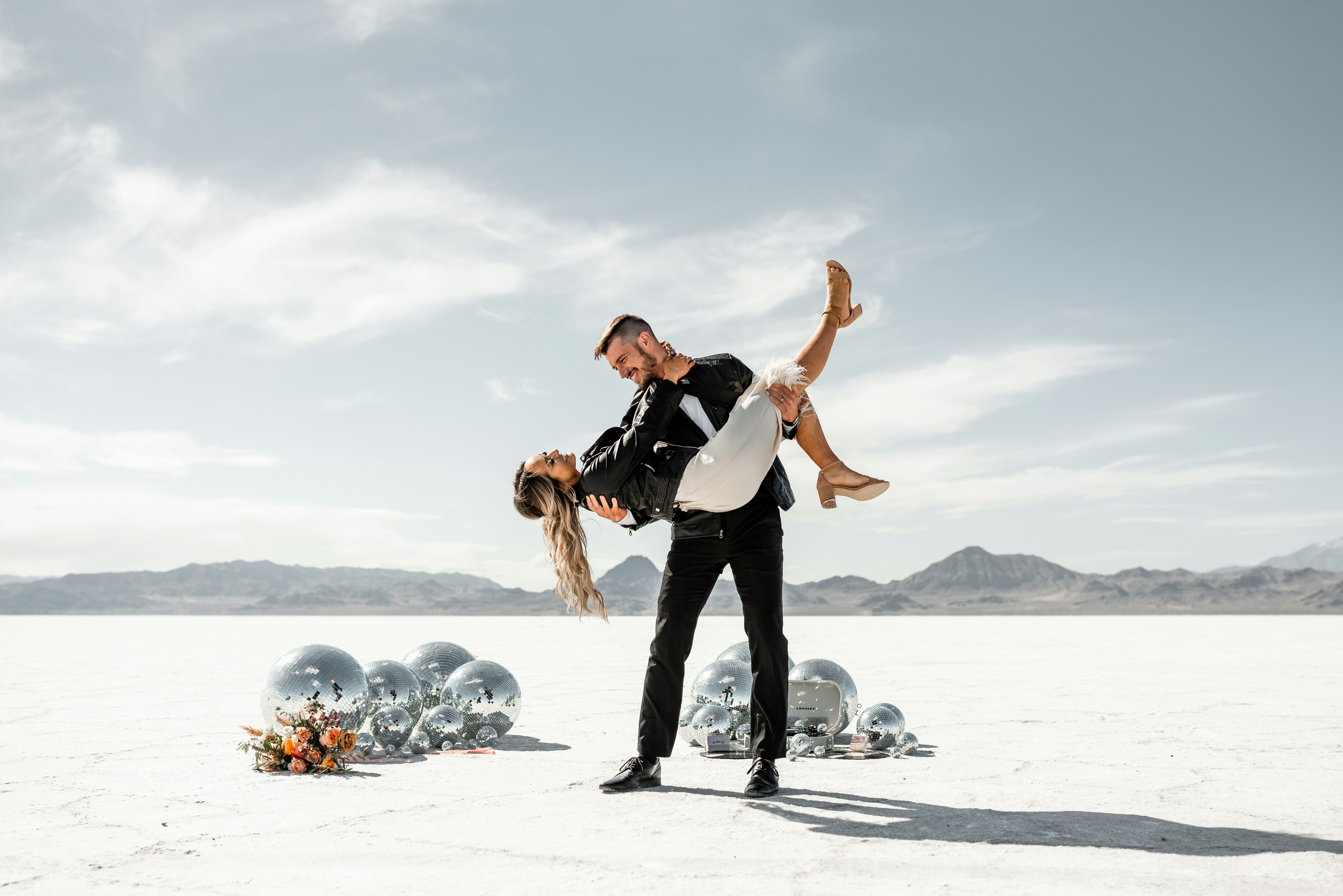 Groom carrying bride