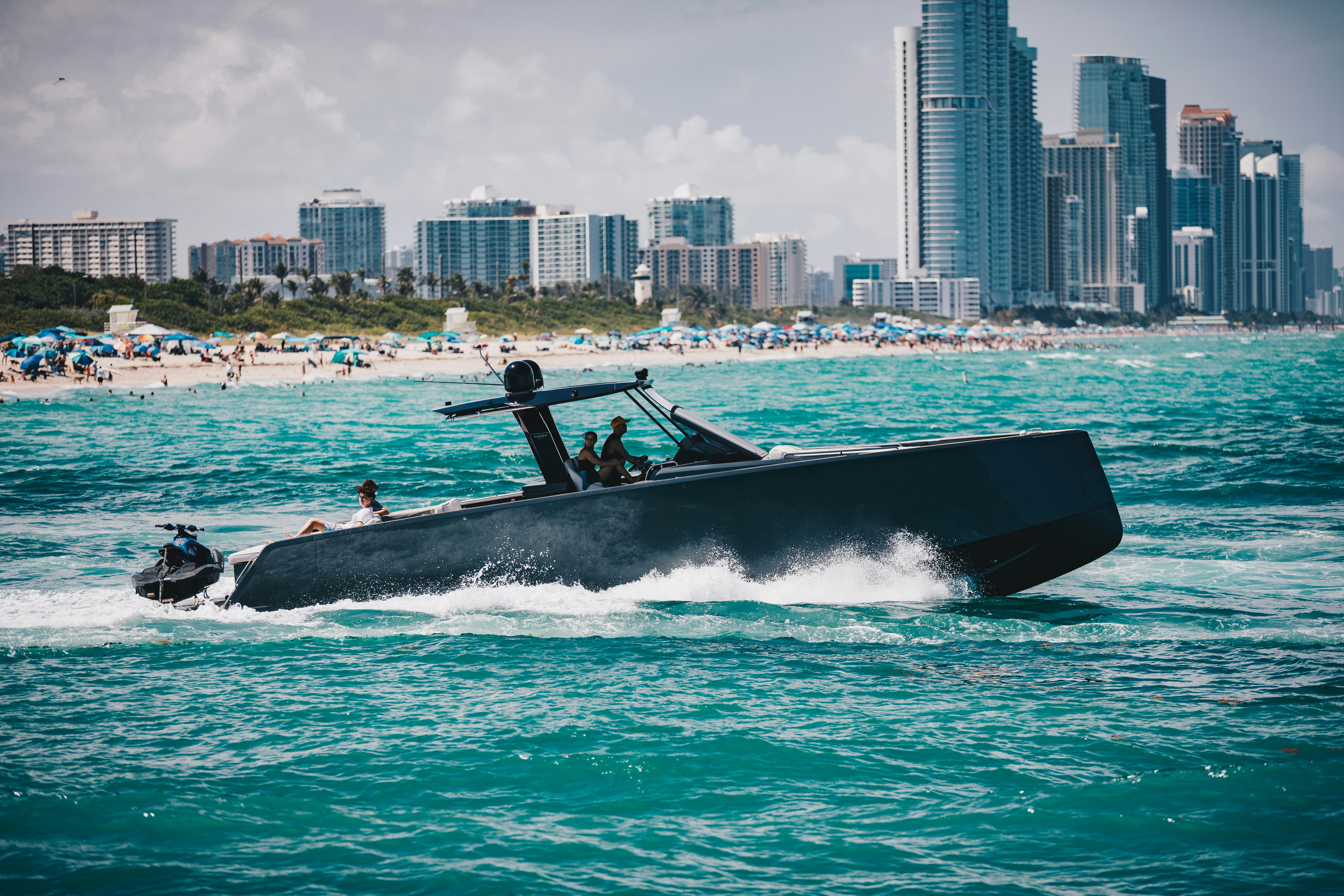 A boat races across the ocean waters.