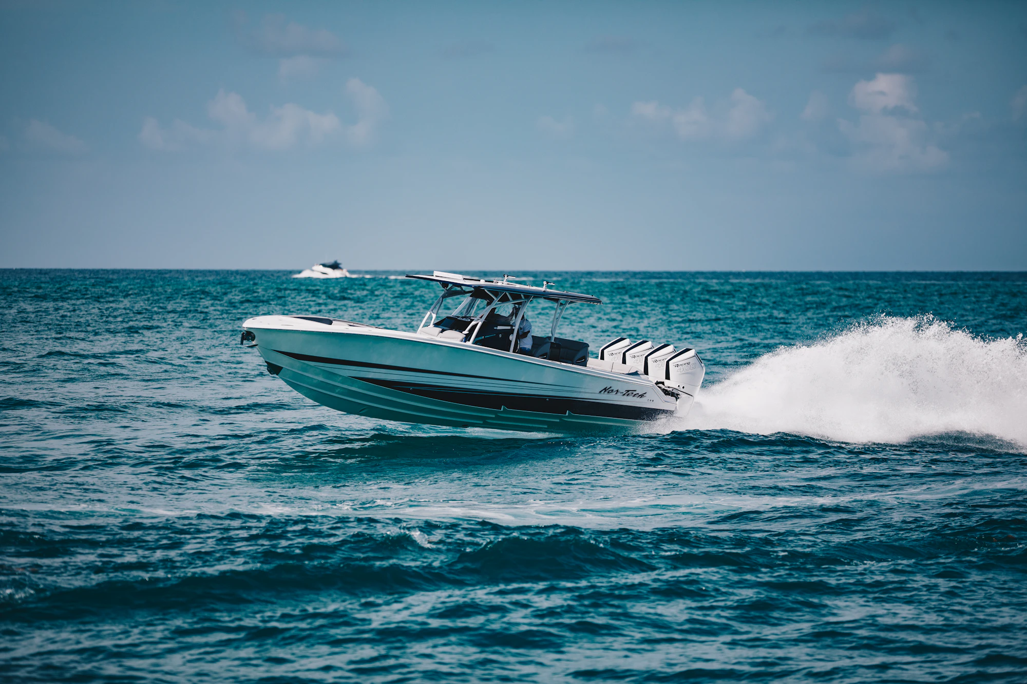 Rental boat cruising across sparkling blue water