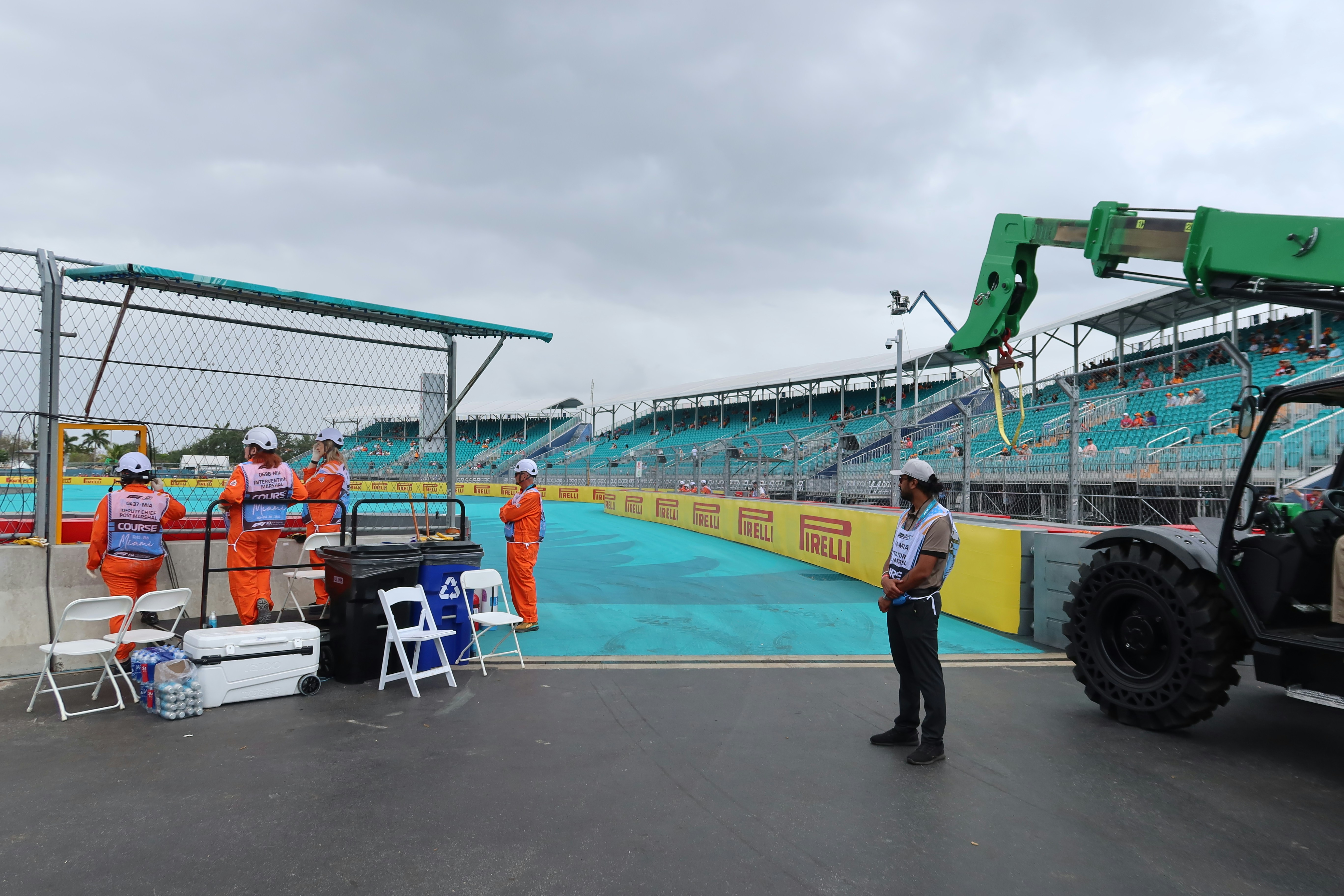People preparing for a race at a motorsport venue