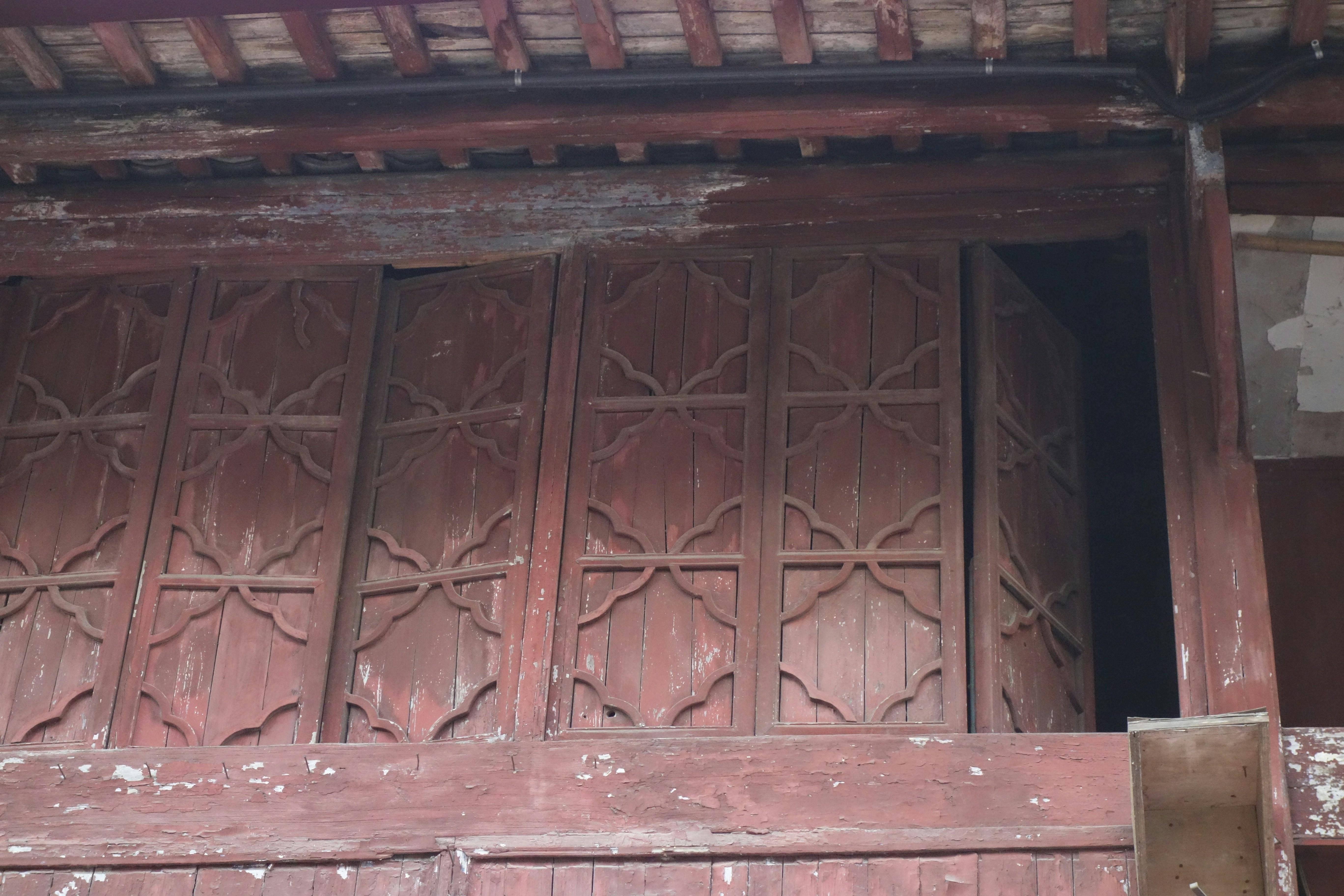 Intricate wooden doors of an old building.