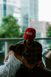 Father and daughter share a tender moment.