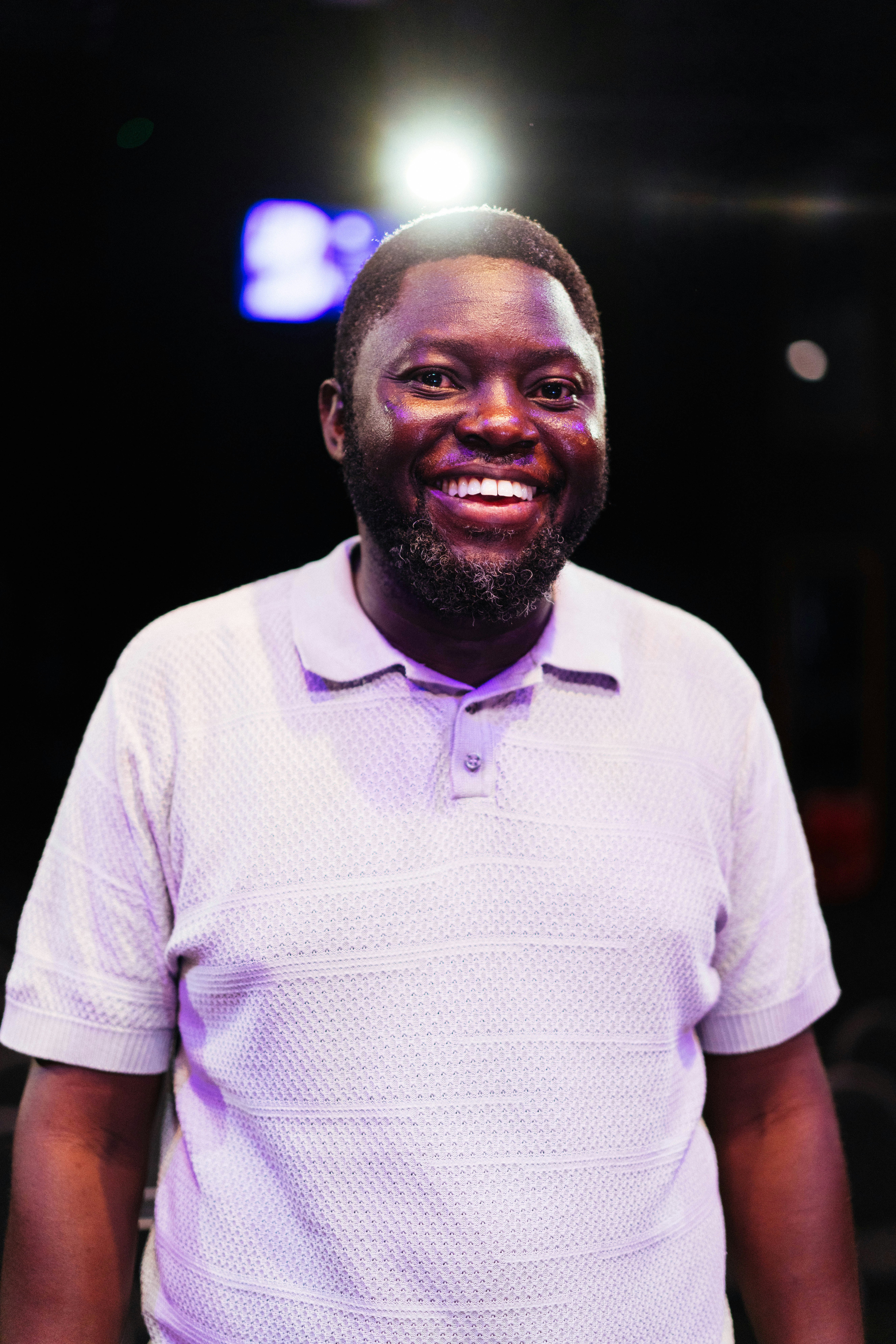 A smiling man poses for a photo.