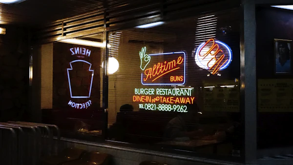 Neon-lit restaurant front at night