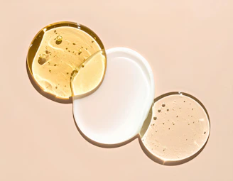 Different serums or lotions are arranged artfully.