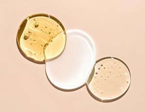 Different serums or lotions are arranged artfully.