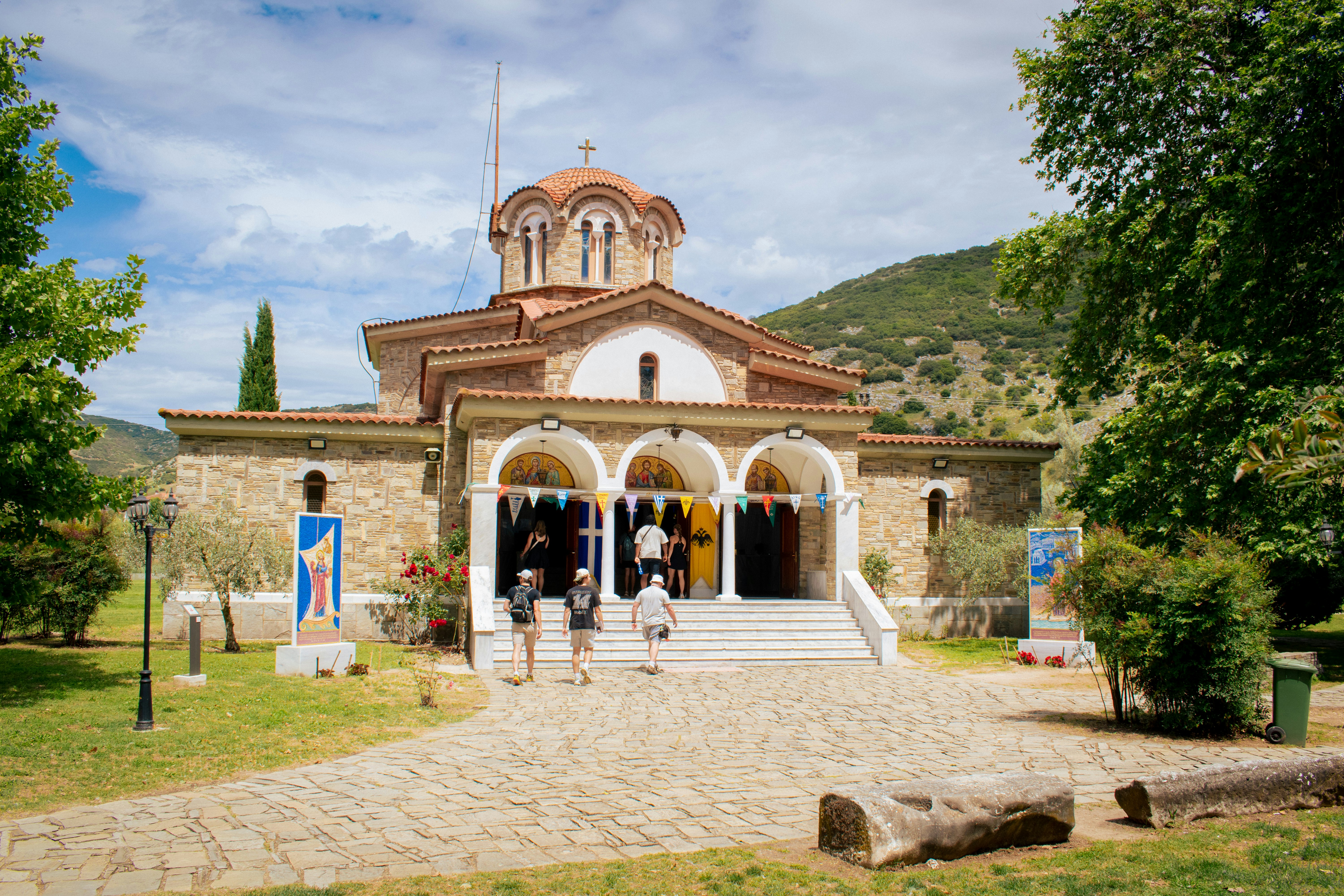 People are entering a beautiful orthodox church.