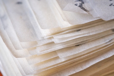 A stack of thin, layered papers.