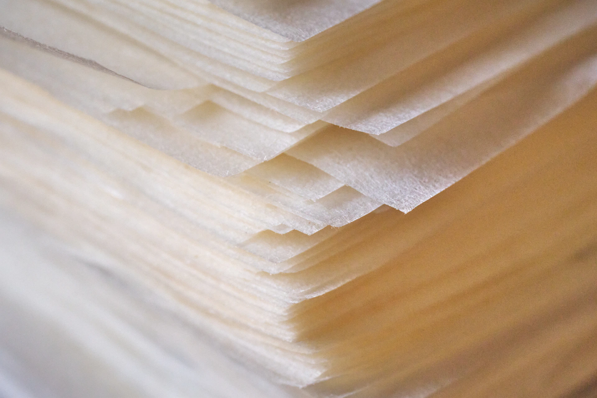 Sheets of thin, translucent paper stacked together