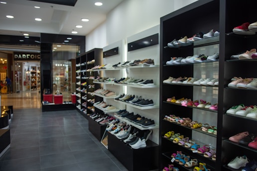 A shoe store displays many shoes.