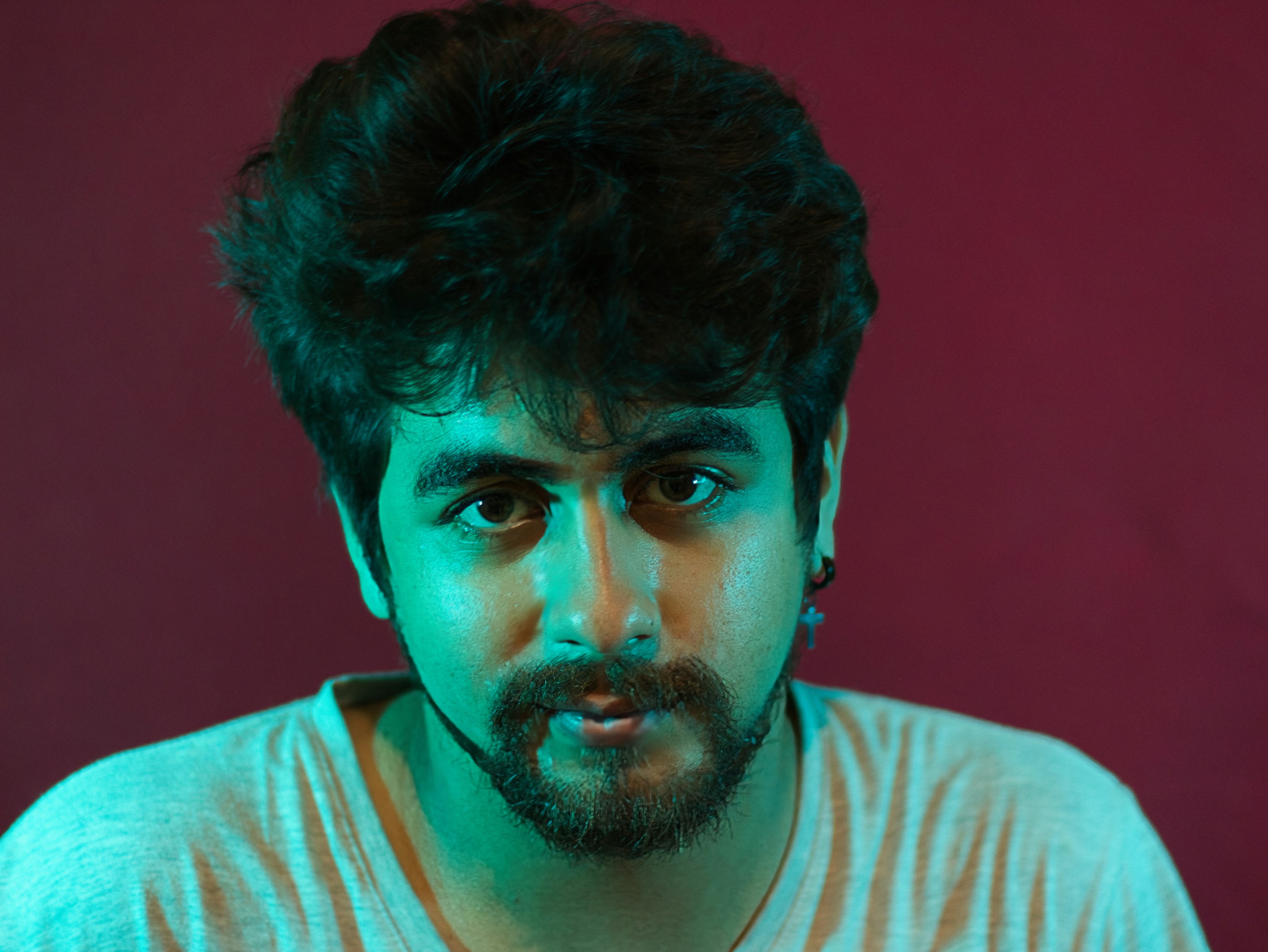 A man looks directly at the camera.