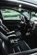 The interior of a car, focusing on the driver's seat.