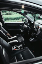 The interior of a car, focusing on the driver's seat.