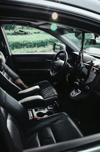 The interior of a car, focusing on the driver's seat.