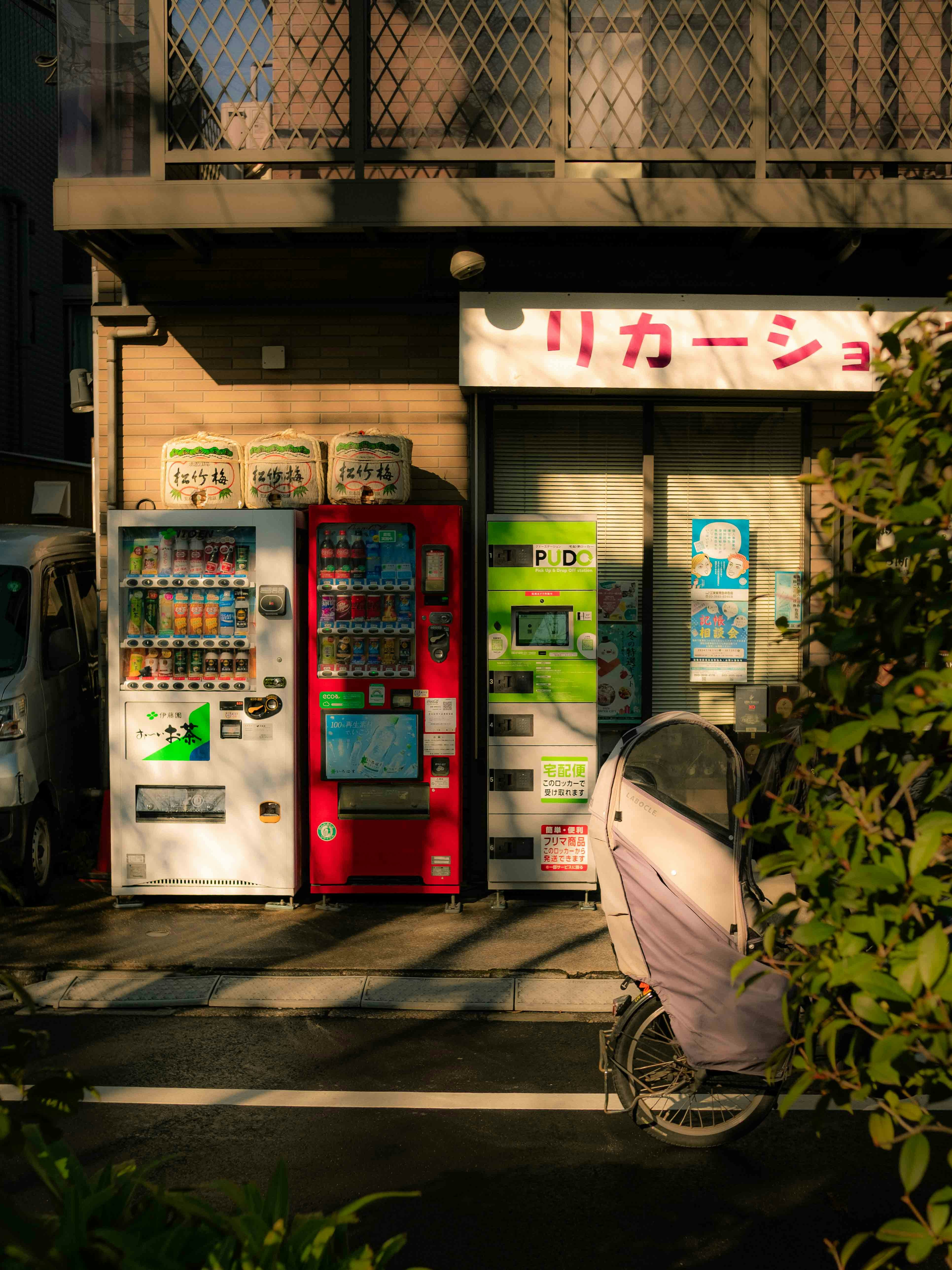 Vending machines stand outside a shop in japan.