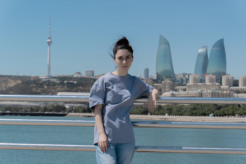 Woman posing with urban skyline