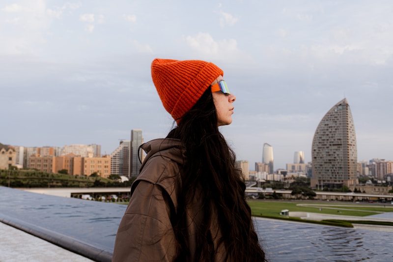 Stylish woman with city skyline in background