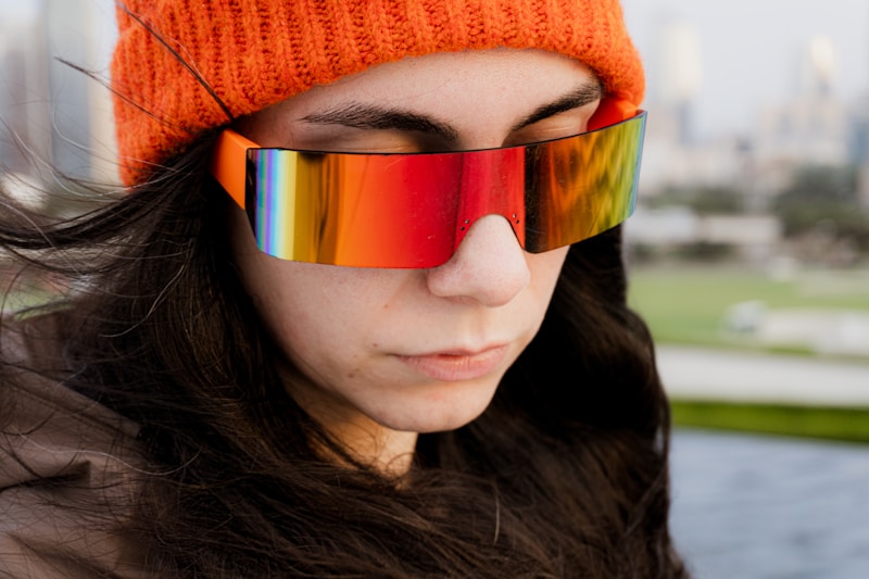 Stylish woman in reflective luxury sunglasses