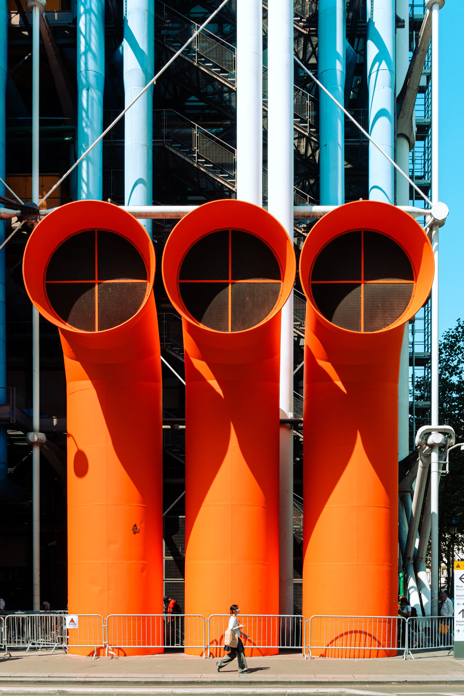 Modern industrial architecture with exposed orange infrastructure