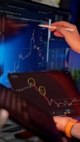 Someone is analyzing financial data on a computer.