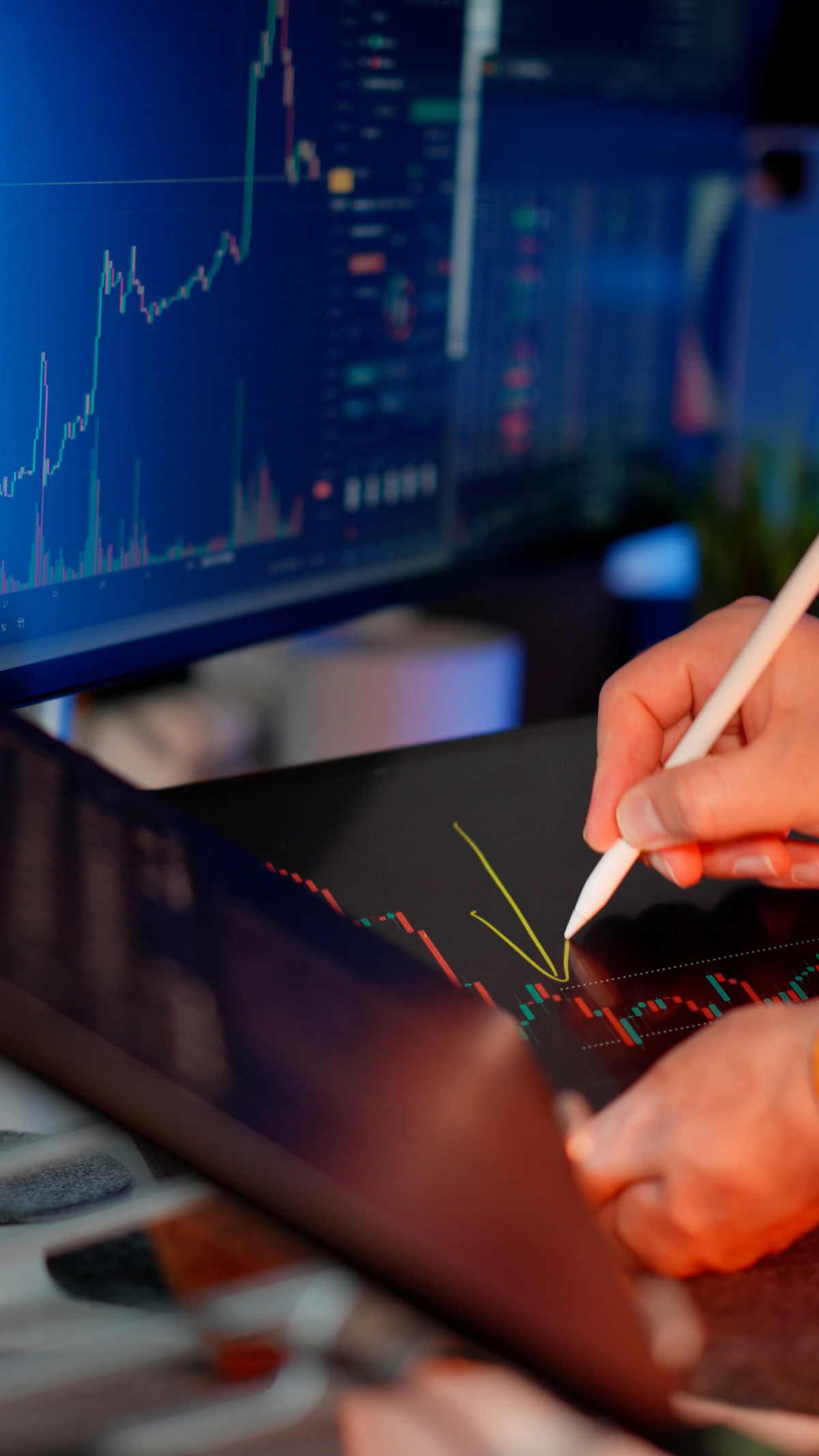 A person marking a chart with a stylus during pattern study